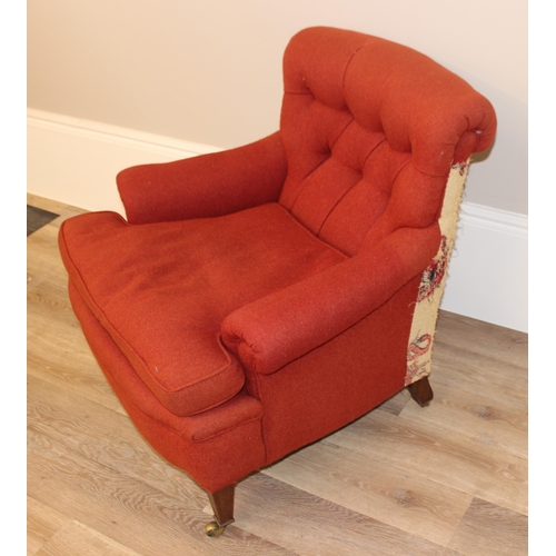 61 - A Victorian button backed low armchair with red upholstery, square tapered mahogany legs and brass c... 