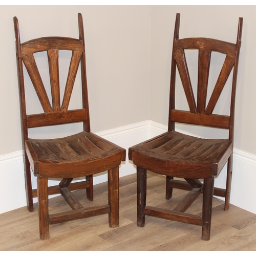 59 - A pair of unusual vintage high back chairs made from wooden cart wheel parts, each approx 115cm tall