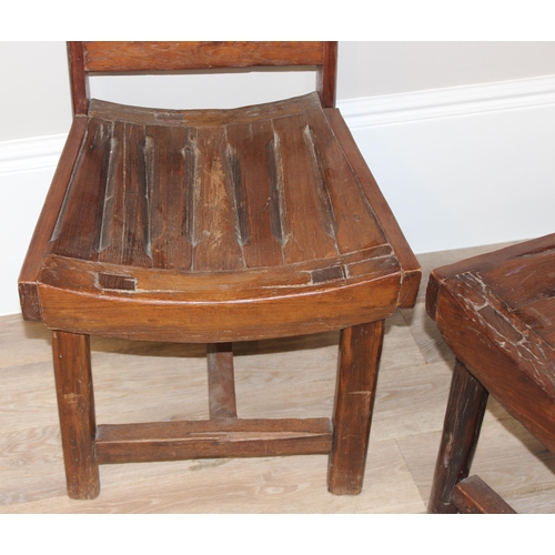 59 - A pair of unusual vintage high back chairs made from wooden cart wheel parts, each approx 115cm tall