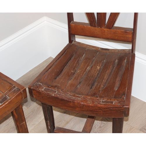 59 - A pair of unusual vintage high back chairs made from wooden cart wheel parts, each approx 115cm tall