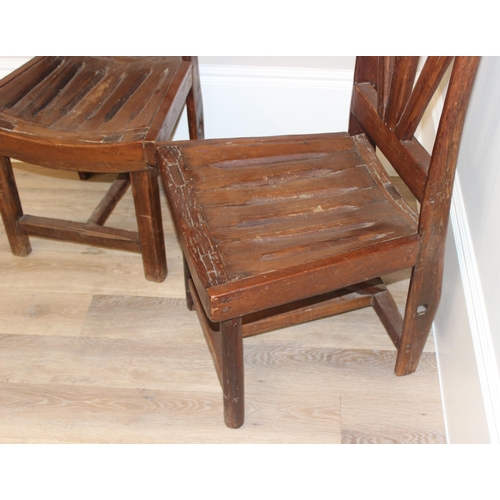 59 - A pair of unusual vintage high back chairs made from wooden cart wheel parts, each approx 115cm tall