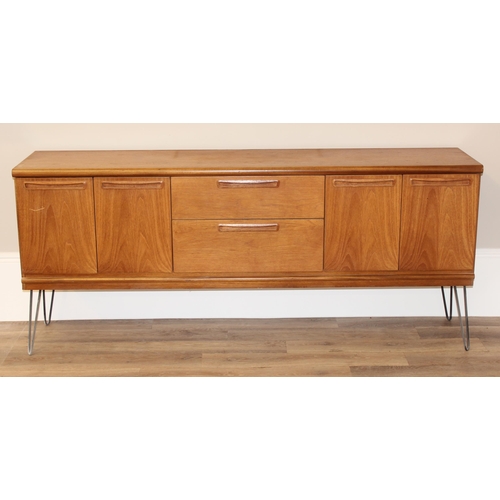 36 - A retro wooden sideboard on hairpin legs, seemingly unmarked but possibly Meredew, 2 drawers to cent... 