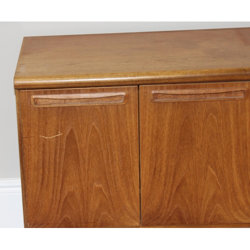 36 - A retro wooden sideboard on hairpin legs, seemingly unmarked but possibly Meredew, 2 drawers to cent... 