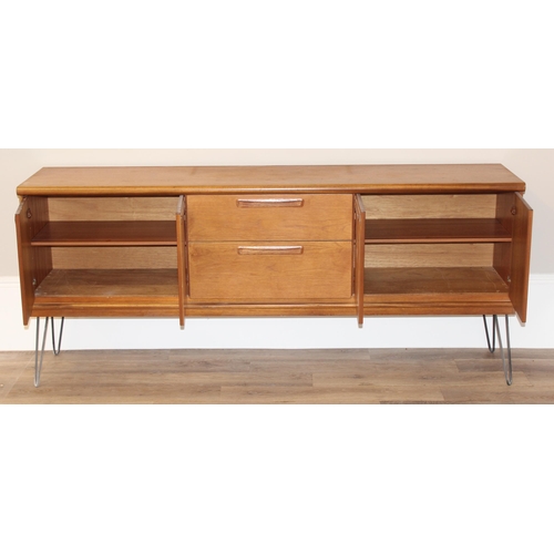 36 - A retro wooden sideboard on hairpin legs, seemingly unmarked but possibly Meredew, 2 drawers to cent... 