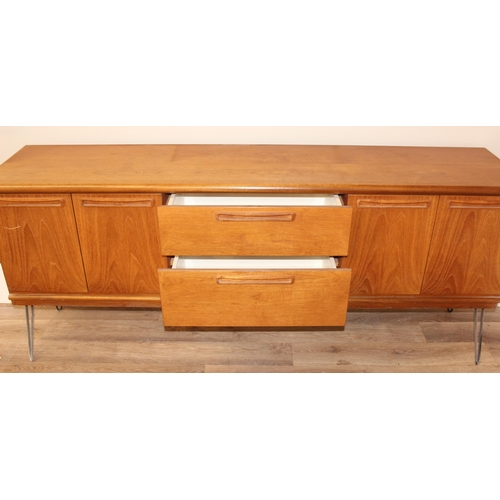 36 - A retro wooden sideboard on hairpin legs, seemingly unmarked but possibly Meredew, 2 drawers to cent... 