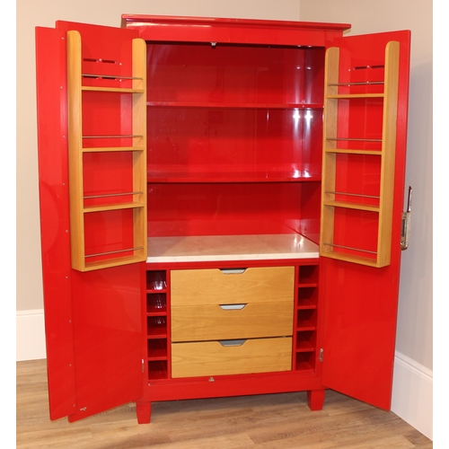 97 - John Lewis of Hungerford, an impressive free standing larder cupboard with glossy red painted finish... 