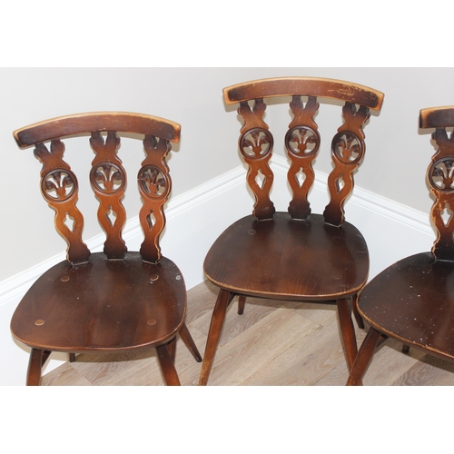 46 - A set of 4 Ercol fleur-de-lys chairs, each approx 79cm tall