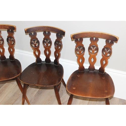 46 - A set of 4 Ercol fleur-de-lys chairs, each approx 79cm tall