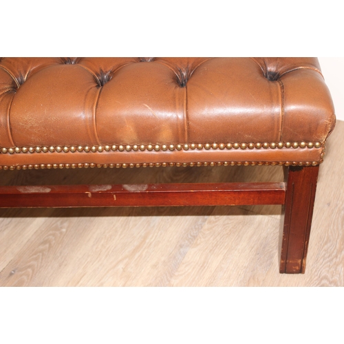 62 - A vintage Chesterfield style button back slipper chair and a similar matching long low footstool, st... 