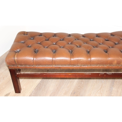 62 - A vintage Chesterfield style button back slipper chair and a similar matching long low footstool, st... 