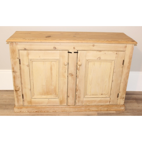 4 - An antique stripped pine 2 door sideboard or cabinet, approx 152cm wide x 49cm deep x 100cm tall