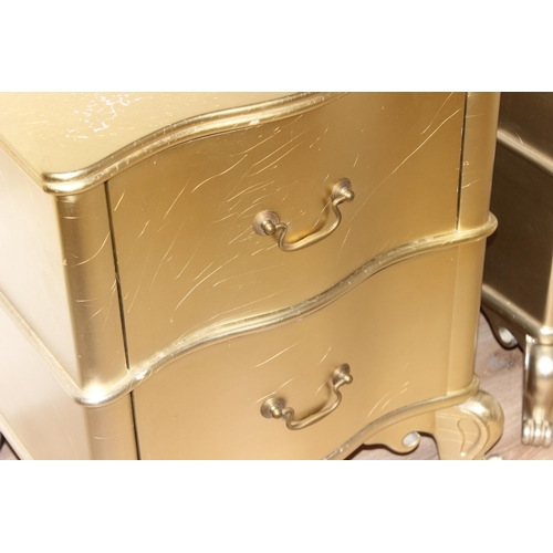 18 - Julian Chichester Regency range, a pair of wavy 2 drawer bedside tables with distressed gold finish ... 