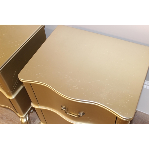 18 - Julian Chichester Regency range, a pair of wavy 2 drawer bedside tables with distressed gold finish ... 