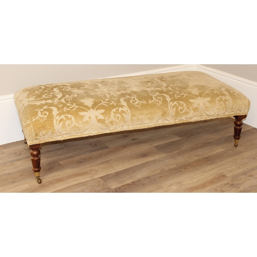 6 - A modern Regency style upholstered foot stool of large proportions on turned wooden legs and brass c... 