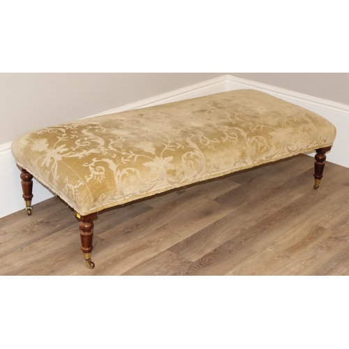 6 - A modern Regency style upholstered foot stool of large proportions on turned wooden legs and brass c... 