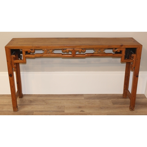 21 - An antique Chinese altar table with carved wooden frieze, likely 19th century, believed to be peach ... 