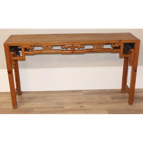 21 - An antique Chinese altar table with carved wooden frieze, likely 19th century, believed to be peach ... 