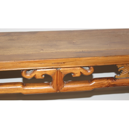 21 - An antique Chinese altar table with carved wooden frieze, likely 19th century, believed to be peach ... 