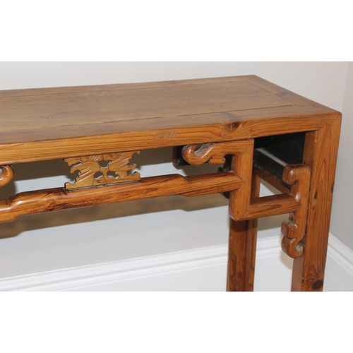 21 - An antique Chinese altar table with carved wooden frieze, likely 19th century, believed to be peach ... 