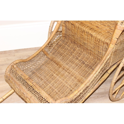 98 - A full size vintage wicker rickshaw, likely c.1950's, approx 220cm wide x 98cm deep x 92cm tall