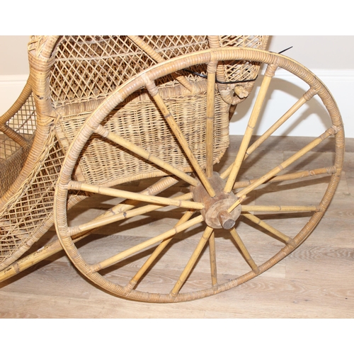 98 - A full size vintage wicker rickshaw, likely c.1950's, approx 220cm wide x 98cm deep x 92cm tall