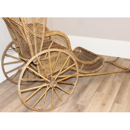 98 - A full size vintage wicker rickshaw, likely c.1950's, approx 220cm wide x 98cm deep x 92cm tall