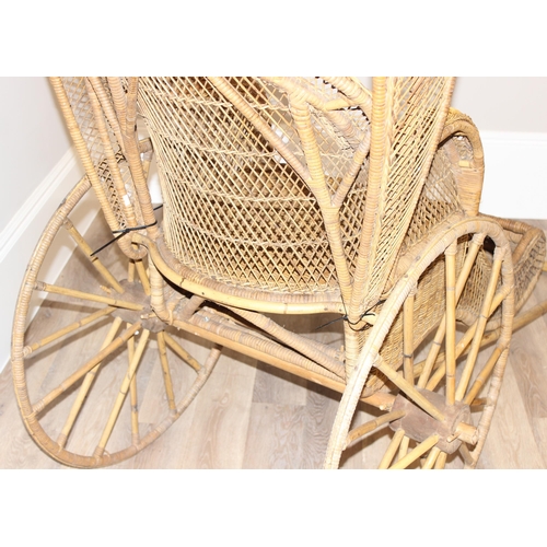 98 - A full size vintage wicker rickshaw, likely c.1950's, approx 220cm wide x 98cm deep x 92cm tall