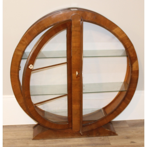 17 - An unusual Art Deco period circular display cabinet with glass shelves, approx 117cm wide x 31cm dee... 