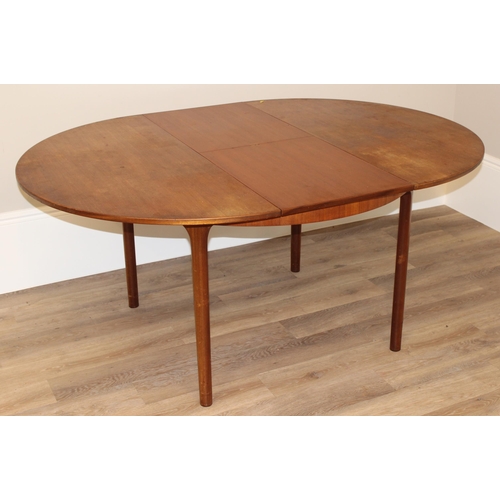 27 - A.H. McIntosh & Co of Kirkcaldy, a retro extendable circular dining table, approx 122cm wide (168cm ... 