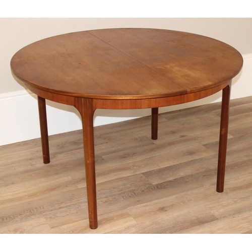 27 - A.H. McIntosh & Co of Kirkcaldy, a retro extendable circular dining table, approx 122cm wide (168cm ... 