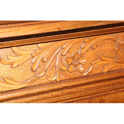 96 - A highly impressive carved wooden double bed, likely early 20th century, consisting of head and foot... 