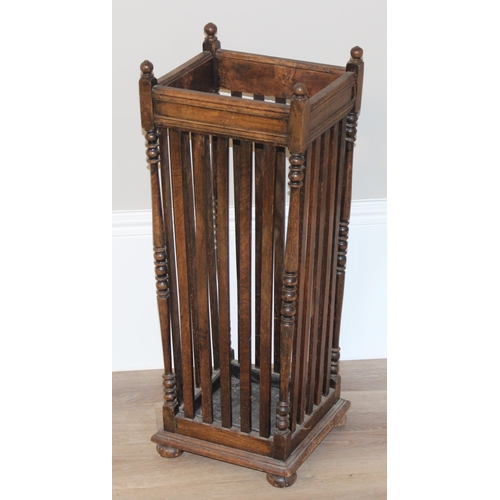 11 - A vintage oak stick stand with slatted uprights, approx 30cm wide x 26cm deep x 67cm tall