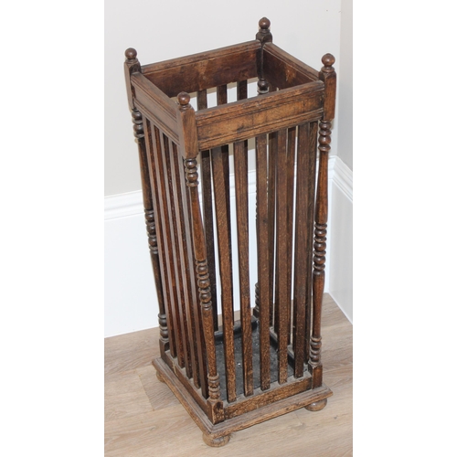 11 - A vintage oak stick stand with slatted uprights, approx 30cm wide x 26cm deep x 67cm tall