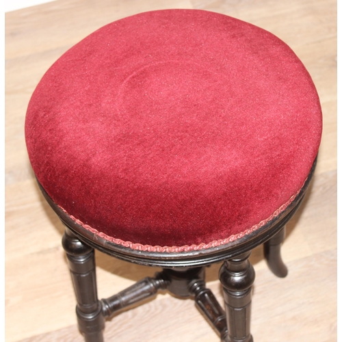 103 - Charles Wadman of Bath - A 19th century ebonised piano stool with red upholstery, height adjustable,... 