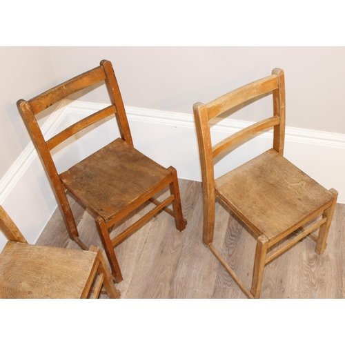 73 - A set of 6 vintage elm stacking children's chairs, the largest approx 65cm tall