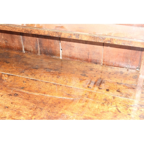 86 - A Georgian oak dresser, the base with 3 drawers with brass drop handles and the top with 3 shelves, ... 