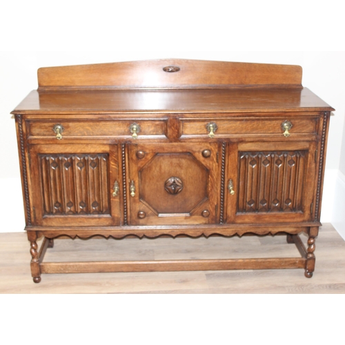 16 - An early 20th century oak sideboard with carved details, approx 151cm wide x 48cm deep x 110cm tall