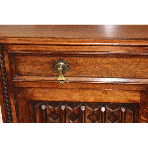 16 - An early 20th century oak sideboard with carved details, approx 151cm wide x 48cm deep x 110cm tall