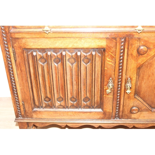 16 - An early 20th century oak sideboard with carved details, approx 151cm wide x 48cm deep x 110cm tall