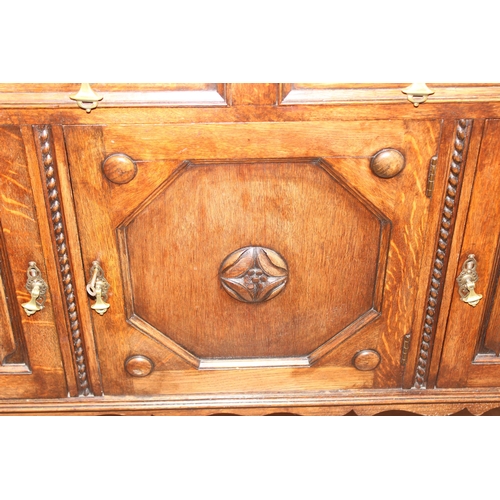 16 - An early 20th century oak sideboard with carved details, approx 151cm wide x 48cm deep x 110cm tall