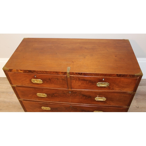 1 - A 19th century mahogany campaign style 2 over 2 chest of drawers, with recessed brass handles and br... 