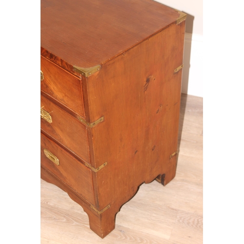 1 - A 19th century mahogany campaign style 2 over 2 chest of drawers, with recessed brass handles and br... 