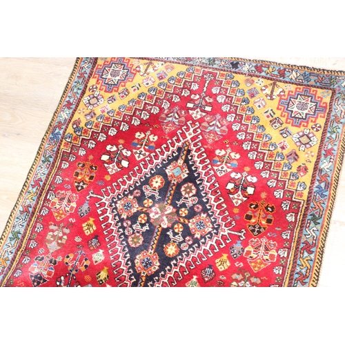 210 - A highly decorative hand made runner rug of red ground, likely Turkish, approx 210cm x 76cm