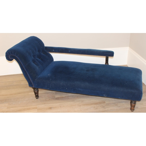 35 - An antique button back chaise longue with navy blue velvet upholstery and wooden legs, approx 165cm ... 