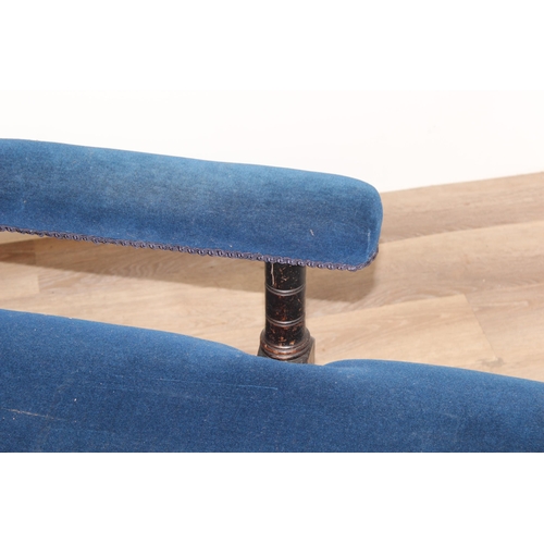 35 - An antique button back chaise longue with navy blue velvet upholstery and wooden legs, approx 165cm ... 