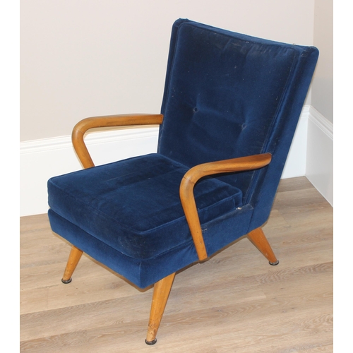 42 - A blue seated retro arm chair with wooden arms, approx 82cm wide x 67cm wide x 81cm tall