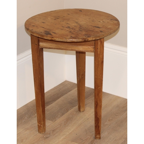 56 - An antique circular topped pine cricket table, approx 52cm diameter x 68cm tall