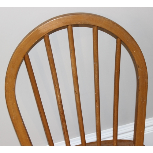 50 - A pair of retro Ercol hoop back dining chairs, approx 87cm tall