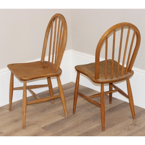 50 - A pair of retro Ercol hoop back dining chairs, approx 87cm tall