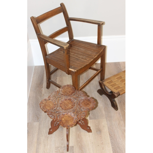 100 - A vintage slatted armchair, Arts & Crafts period seagrass topped footstool and a small Indian carved... 